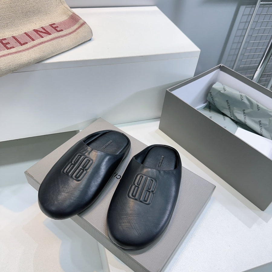 BALENCIAGA 25S MULES IN BLACK LAMBSKIN